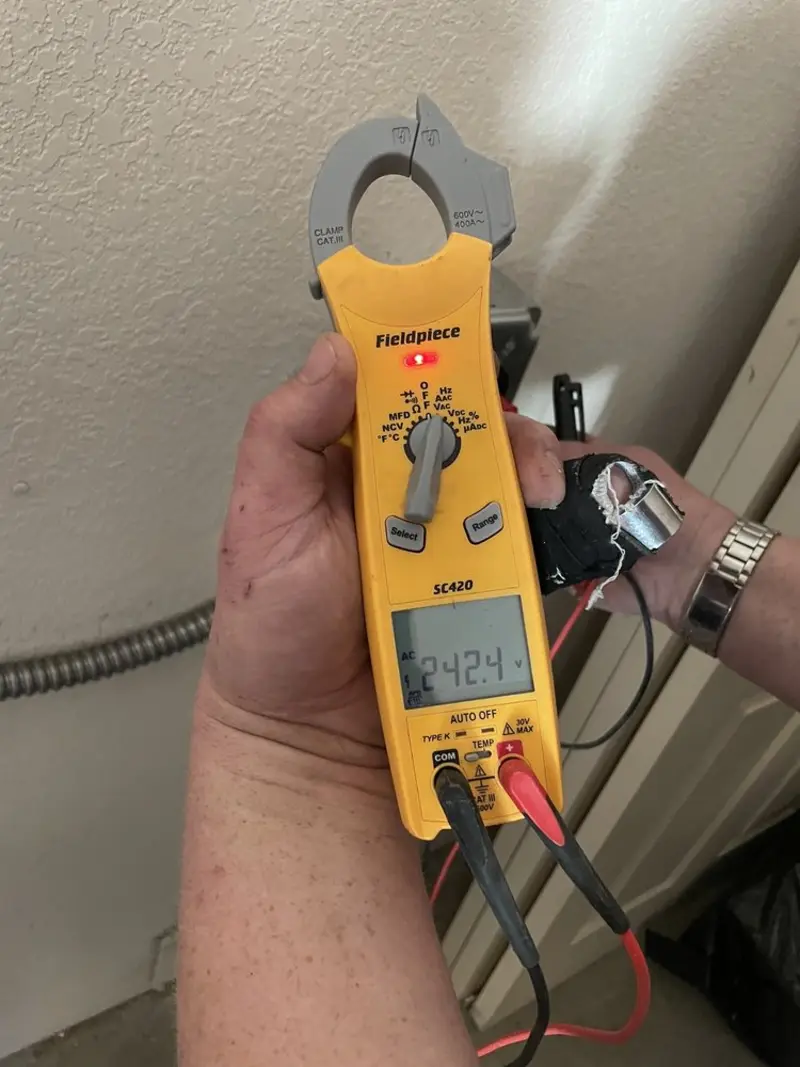 Voltage testing with clamp meter during Whole House Surge Protector in Millvale